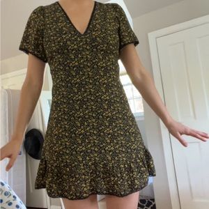 Flirty puff sleeve v neck floral mini dress with lace up back toe detail